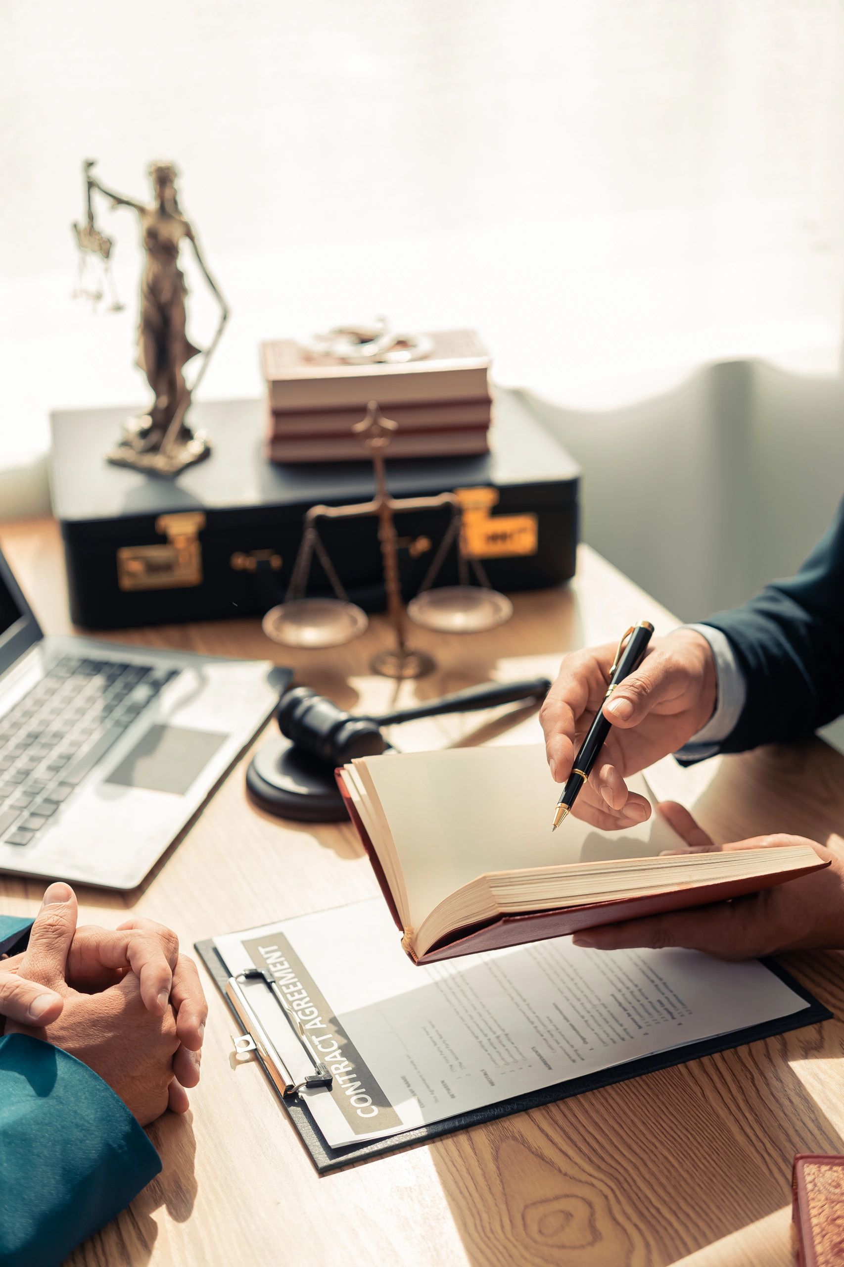 Legal documents on a lawyer's desk with gavel and scales of justice